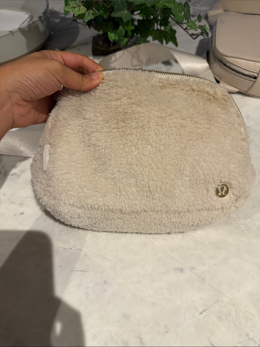 lululemon athletica Cream Sherpa belt bag with Gold Logo